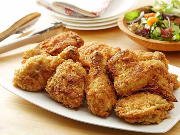 Dinners with fried chicken legs and honey