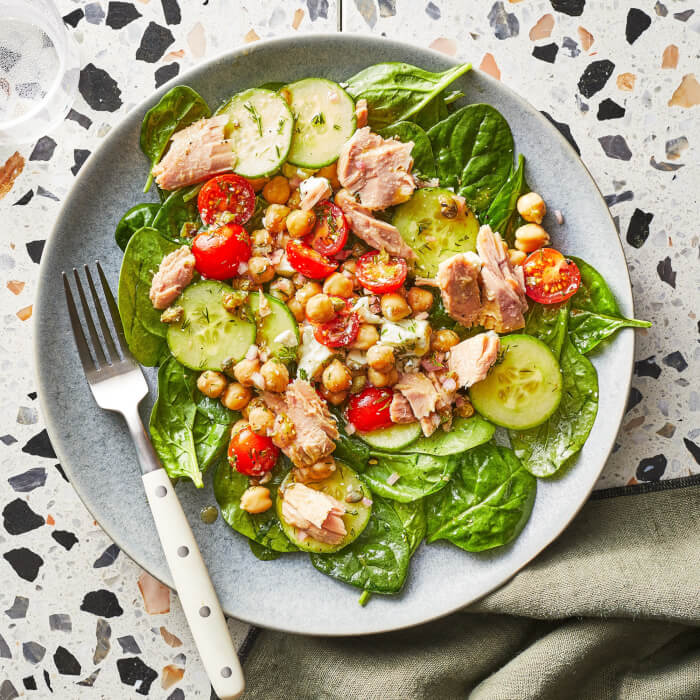 Salad with quinoa, chickpeas, and roasted red pepper hummus