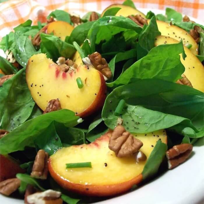 Peach and pecan salad with spinach
